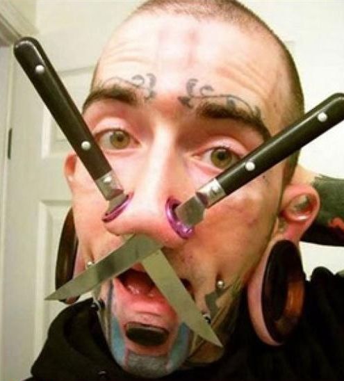 face tattoo and piercing