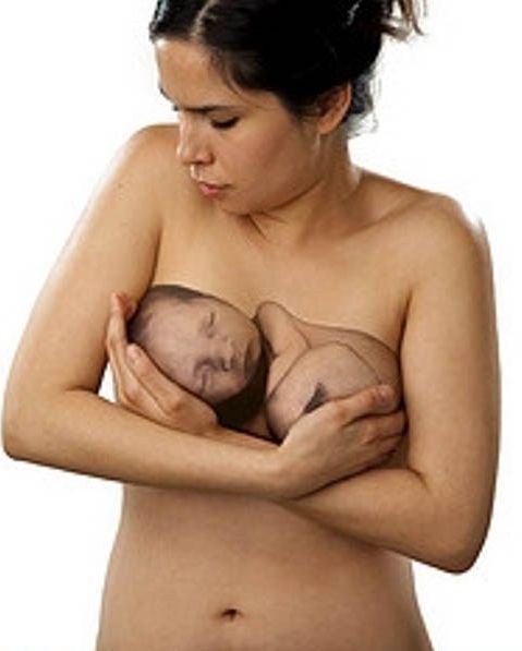new born baby tattoo on breasts